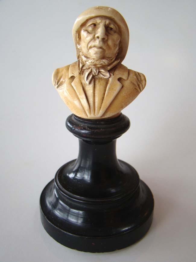 A small and charming ivory or bone bust of a fisherman mounted on a stand circa 1880 — image 2